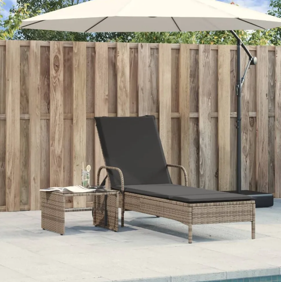 vidaXL Ligbed met wielen en kussen poly rattan grijs