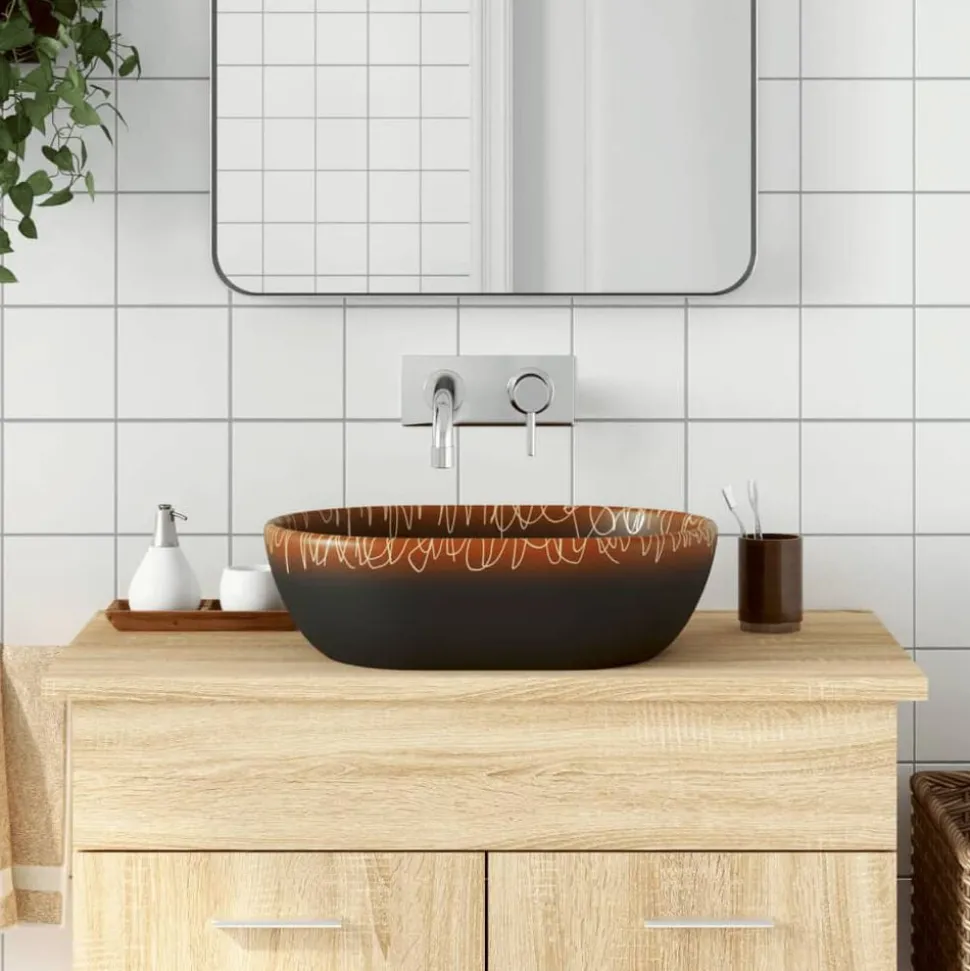 vidaXL Opzetwasbak ovaal 47x33x13 cm keramiek zwart en oranje